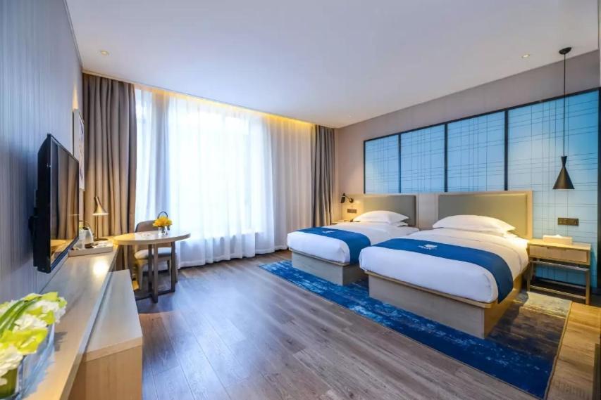 Echarm Hotel Ji'Nan Railway Station Цзинань Экстерьер фото